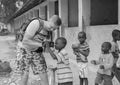 European tourist showing camera to african children