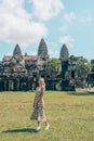 European tourist stands in Angkor Wat in Cambodia