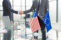 European Union and American leaders shaking hands on a deal agreement. Royalty Free Stock Photo