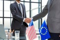 European Union and American leaders shaking hands on a deal agreement. Royalty Free Stock Photo