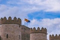 European union and aragon spain flags against the sky on a stone historic castle Royalty Free Stock Photo