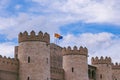 European union and aragon spain flags against the sky on a stone historic castle Royalty Free Stock Photo