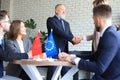 The European Union and Chinese leaders shaking hands on a deal agreement Royalty Free Stock Photo