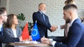 European Union and Chinese leaders shaking hands on a deal agreement Royalty Free Stock Photo