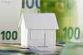 European Union currency and a detached house model Royalty Free Stock Photo