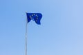 European Union EU flag is flying on blue sky background. Banner, place for text Royalty Free Stock Photo