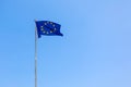 European Union EU flag is flying on blue sky background. Banner, place for text Royalty Free Stock Photo