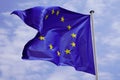 European Union EU Flag yellow stars Waving in mat on cloud blue sky background Royalty Free Stock Photo