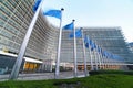 European Union EU flags waving in front of the Berlaymont building, headquarters of the European Commission in Brussels. Royalty Free Stock Photo