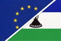 European Union or EU and Lesotho national flag from textile. Symbol of the Council of Europe association