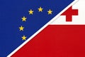 European Union or EU and Tonga national flag from textile. Symbol of the Council of Europe association