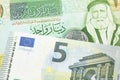 A one Jordanian dinar with a Euro note