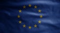 European Union flag waving on wind. Close up of Europe banner blowing soft silk Royalty Free Stock Photo