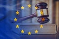 European Union flag with wooden gavel in close-up Royalty Free Stock Photo