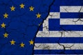 European Union and Greece flag on textured cracked ground. The concept of cooperation between the two countries. 3d rendering Royalty Free Stock Photo