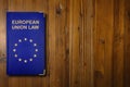 European Union law book on a wooden desk Royalty Free Stock Photo