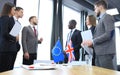 European Union and United Kingdom leaders shaking hands on a deal agreement.