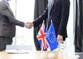 European Union and United Kingdom leaders shaking hands on a deal agreement. Brexit. Royalty Free Stock Photo