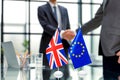 European Union and United Kingdom leaders shaking hands on a deal agreement. Royalty Free Stock Photo