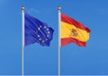 European Union vs Spain. Thick colored silky flags of European Union and Spain. 3D illustration on sky background. - Illustration Royalty Free Stock Photo