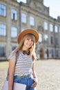European university student girl in hat and laptop at campus Royalty Free Stock Photo