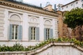 European windows with wooden shutters. Old house exterior. Royalty Free Stock Photo