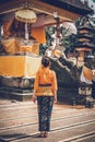 European woman rare view in balinese temple, Bali island.