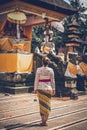 European woman rare view in balinese temple, Bali island.