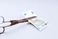 Euros banknote and a scissors Royalty Free Stock Photo