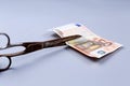 Euros banknote and a scissors Royalty Free Stock Photo