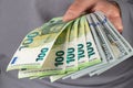100 Euros and 100 dollars banknotes in men hands. Close up Royalty Free Stock Photo