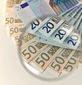 Euros notes through a magnifying lens