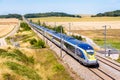 A Eurostar high-speed train in the countryside