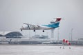 Luxair landing in Munich Airport, snow