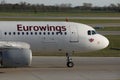 Eurowings plane taxiing on taxiway, cabin crew close-up