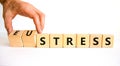 Eustress or stress symbol. Psychologist turns cubes and changes the concept word Eustress to Stress. Beautiful white table white