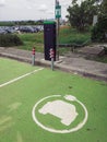 EV electric car power station with blink logo at outdoors parking area