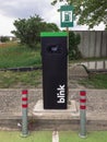 EV electric car power station with blink logo at outdoors parking area