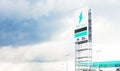 The EV electric vehicle charger station with the sky and nimbus cloud Royalty Free Stock Photo