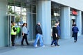 Evacuation of an office building. People exit the building on exit door.