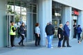 Evacuation of an office building. People exit the building on exit door.