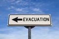 Evacuation road sign, arrow on blue sky background Royalty Free Stock Photo