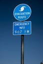 Evacuation route highway sign and blue skies