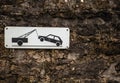 Evacuation on tow truck sign on old stone wall