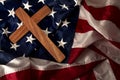 Evangelical America, christianity, born again christian and fundamentalist religious right concept with close up on a wooden cross Royalty Free Stock Photo