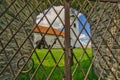 View of The Evangelical Church in Rimavska Bana throught the metal gate