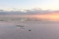 Evaporation during the freezing of water in the river, formation of ice, sunset, Ob reservoir, Siberia Royalty Free Stock Photo