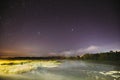 Evaporation Over River Lake At Night. Milky Way Galaxy In Night Starry Sky Above Lake River Landscape At Night. Glowing