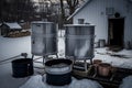 evaporator set up for small-scale maple syrup production, with cooking pots and buckets ready to go Royalty Free Stock Photo