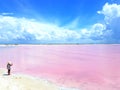 Even little girl can not resist the charming pink lagoon in Las Coloradas Yucatan Mexico.